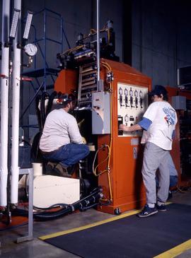 Photograph of students operating an equipment at the Canadian Plastics Training Centre