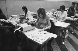 Photograph of Commercial Students using Various Electronic Equipment