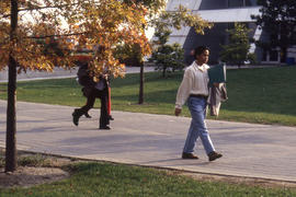 Photograph of students on campus walkway