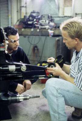 Photograph of Robert Smith and student  in the Small Engine Repair lab