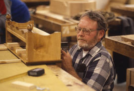 Photograph of a student in the Cabinet Making/Woodworking lab