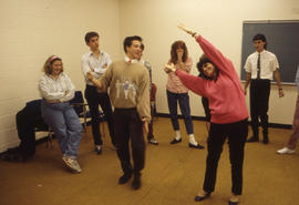 Photograph of Theatre students and an instructor doing an exercise