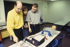 Photograph of emergency skill faculty member instructing students