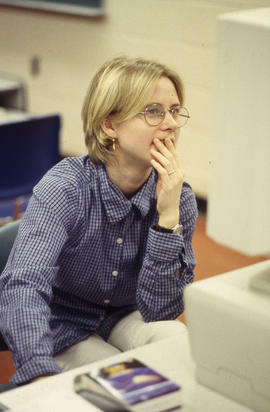 A photograph of a student working at a computer