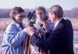 Photograph of Civil Engineering students making adjustments to field equipment