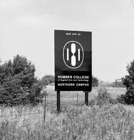Photograph of a sign advertising the new North campus site