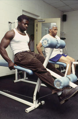 A photograph of Athletic Center members using a leg press