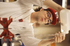 Photograph of a Student Using a Glass Tube