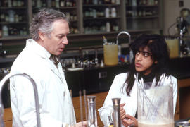 Photograph of an instructor and student in a chemistry lab