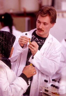 Photograph of two students in the chemistry lab