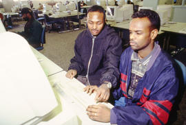Photograph of two students at work in the Open Learning Centre lab
