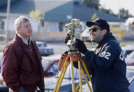 Photograph of Frank Mee, Civil Engineering professor working with a student