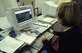 Photograph of a student working with CAD drawings