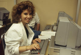 Photograph of a Journalism student working on an article