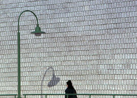 Photograph of a student walking on the walkway at North campus