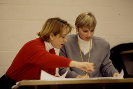 Photograph of persons reviewing architectural plans
