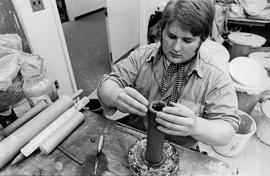 Photograph of a Student Working with a Pottery Wheel in a Ceramics Class