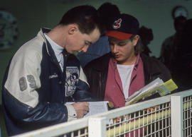 Photograph of students standing next to a railing