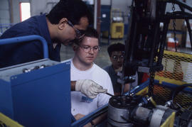 Photograph of an Instructor explaining an equipment