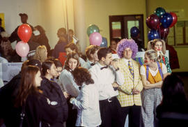 Photograph of students and clowns gathered together