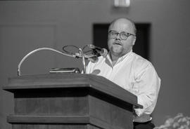Photograph of Greg Gatenby speaking at a creative writing workshop