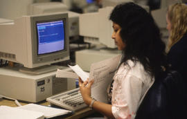 Photograph of a student working in the main computer lab
