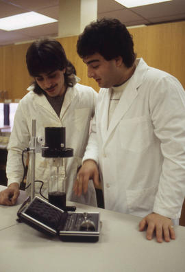 Photograph of a student and instructor working with equipment