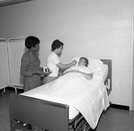 Photograph of Nursing students practicing procedures