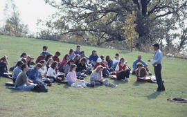 Photograph of an Instructor Lecturing Outside