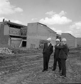 Photograph of Gordon Wragg and others inspecting the North campus construction site