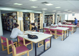 Photograph of students studying the library