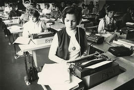 Photograph of students in a typing class using a Dictaphone