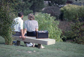 Photograph of a Couple Sitting on a Bench