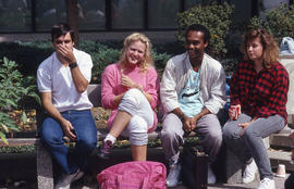 Photograph of students seated on a bench