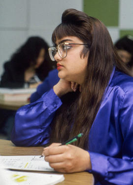 Photograph of Travel and Tourism student sitting in a classroom listening to a lecture
