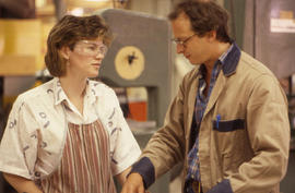 Photograph of Instructor talking to student in woodworking shop