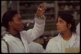 Photograph of two students in a lab