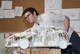 HSF President Nick Farnell working on a car design : [photograph]