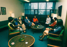 Photograph of staff and students in the Osler lounge