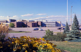 Photograph of a view of campus buildings from the arboretum