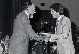 Photograph of Siem Vandenbroek Congratulating a Student at an Award Function