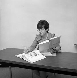 Photograph of Lynda Robichaud studying