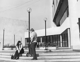 Photograph of two Students Talking Outside of the Courtyard