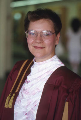 Photograph of a graduate in gown