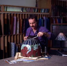 Photograph of Someone Creating a Tiffany-Styled Lamp
