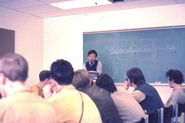 Wayson Choy teaching a communications class : [photograph]