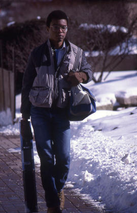 Photograph of student on the walkway in winter
