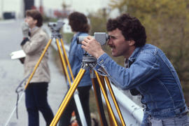 Photograph of students using survey equipment during an exercise