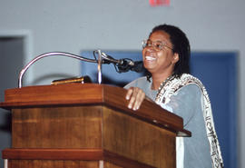 Photograph of Dionne Brand at the podium