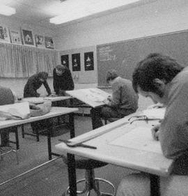 Photograph of Ron Geard Assisting Students at the Drawing Table